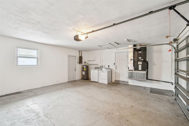 garage featuring separate washer and dryer, electric water heater, and a garage door opener