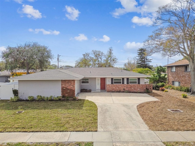 ranch-style home with a front yard