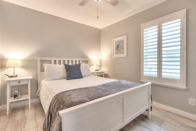 bedroom featuring ceiling fan and hardwood / wood-style flooring