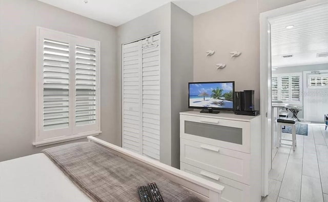 bedroom with light hardwood / wood-style flooring