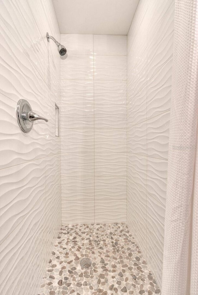 bathroom with a shower with curtain