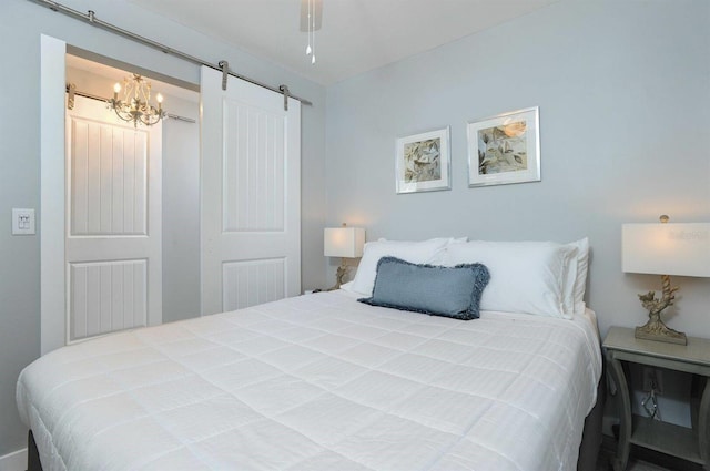 bedroom with a closet and a barn door