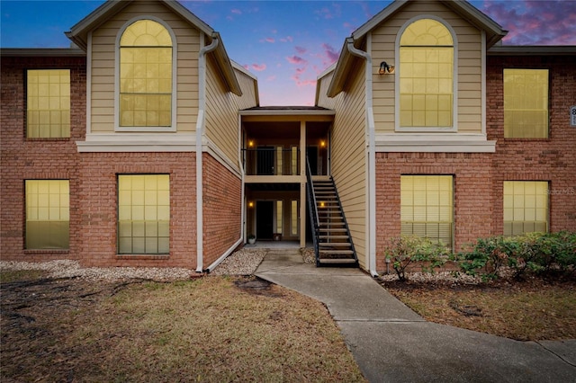 view of outdoor building at dusk