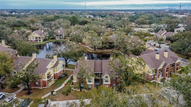 drone / aerial view with a water view