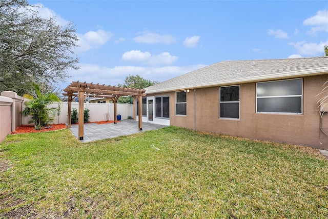 back of house with a patio, a yard, and a pergola