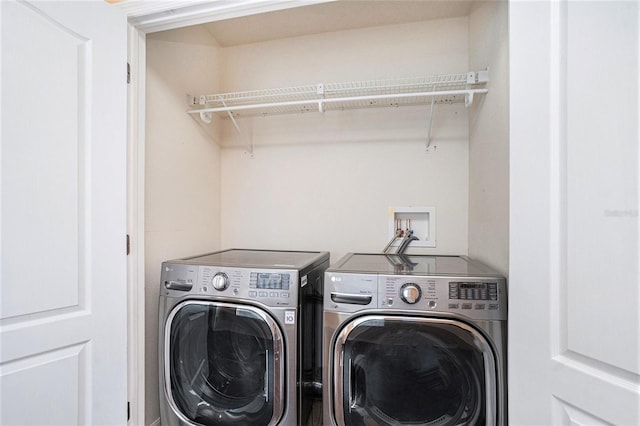 laundry room with washer and clothes dryer