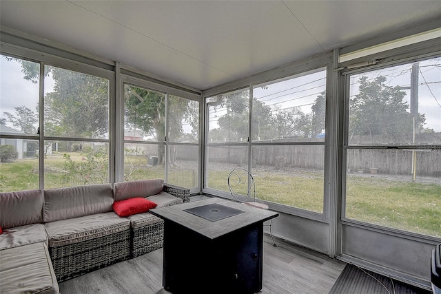 sunroom / solarium featuring a healthy amount of sunlight