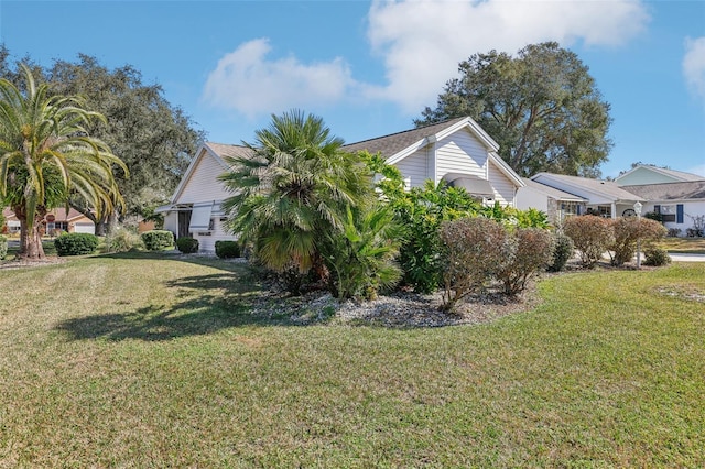 view of property exterior featuring a lawn