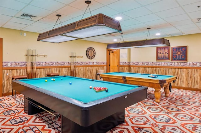 rec room with billiards, a paneled ceiling, and wood walls