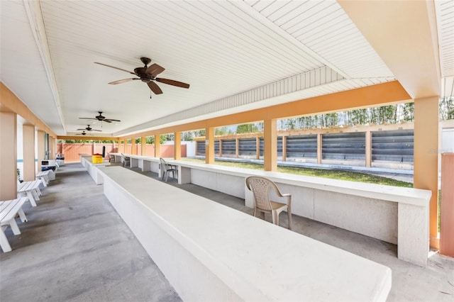 view of patio / terrace with a bar and ceiling fan