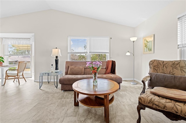 living room featuring vaulted ceiling