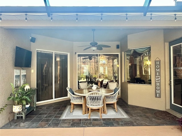 view of patio featuring ceiling fan