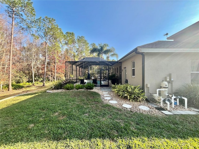 view of yard featuring a lanai