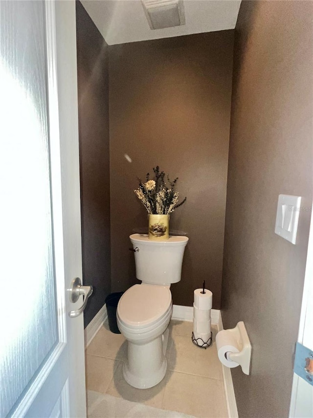 bathroom featuring tile patterned floors and toilet