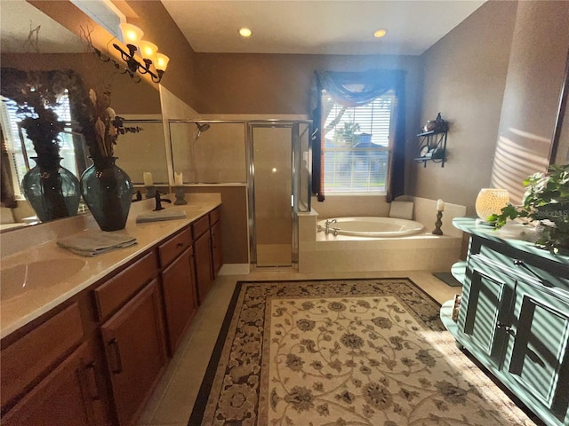 bathroom with independent shower and bath, vanity, and tile patterned floors