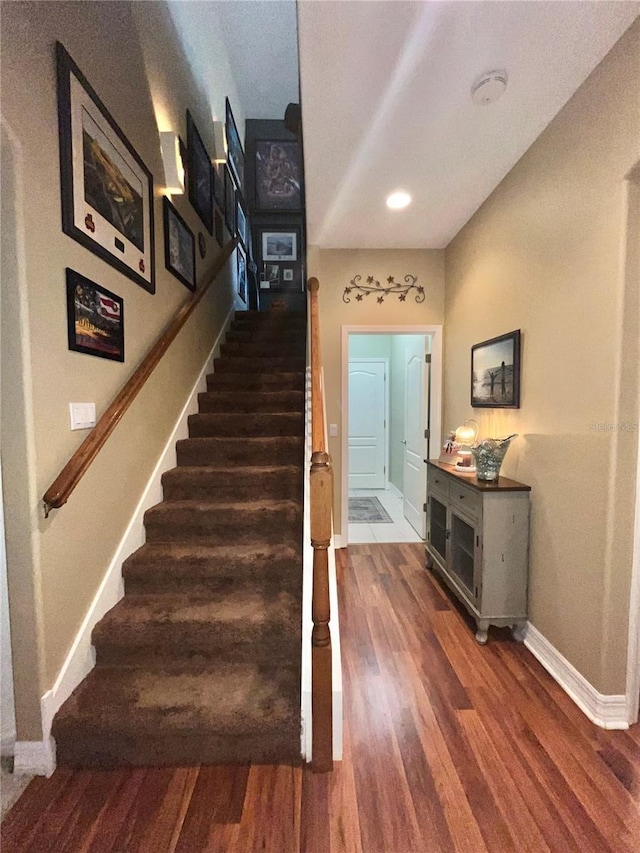 staircase featuring hardwood / wood-style floors