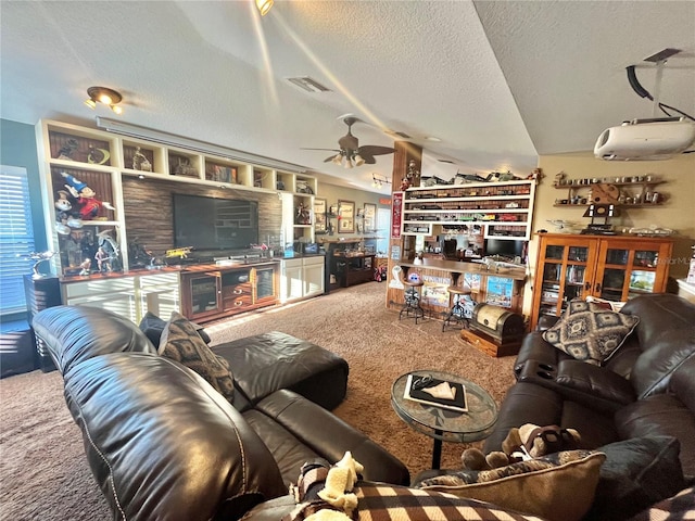 carpeted living room featuring vaulted ceiling, ceiling fan, and a textured ceiling