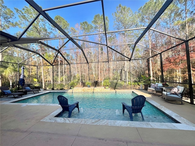 view of pool featuring a patio area and glass enclosure