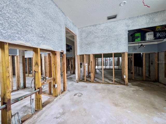 miscellaneous room featuring a textured ceiling