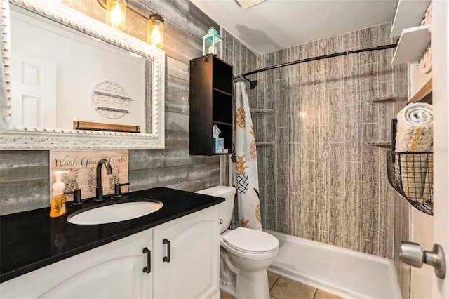 bathroom with toilet, vanity, tile patterned floors, and a shower with shower curtain