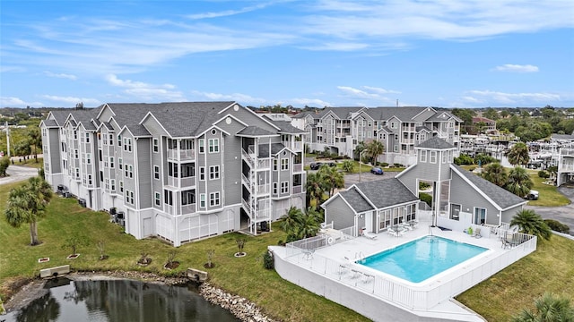 birds eye view of property with a water view