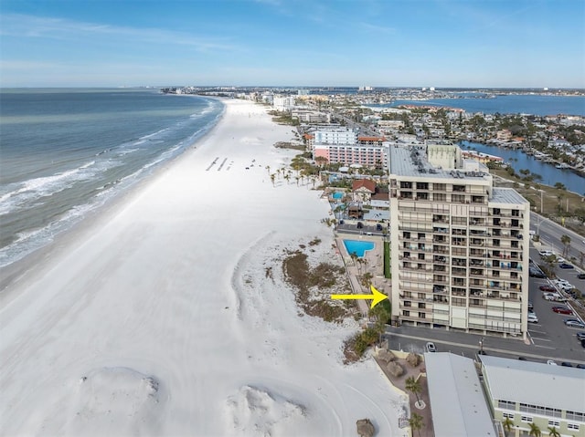 drone / aerial view featuring a water view and a beach view