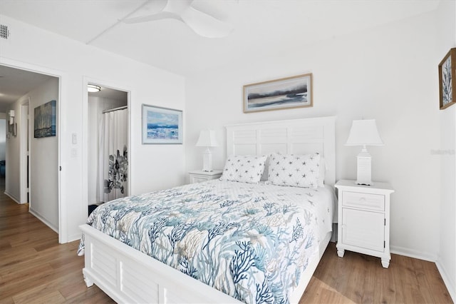 bedroom featuring hardwood / wood-style flooring and ceiling fan