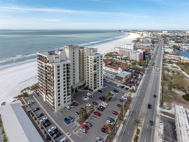 birds eye view of property featuring a water view and a view of the beach