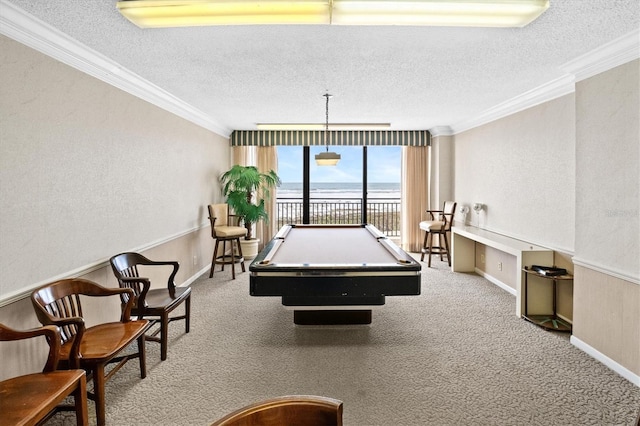 recreation room featuring light carpet, pool table, ornamental molding, and a textured ceiling