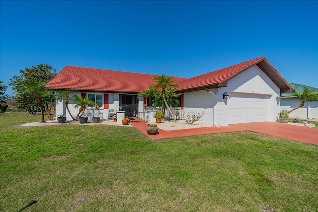 view of front of house featuring a garage, covered porch, and a front lawn