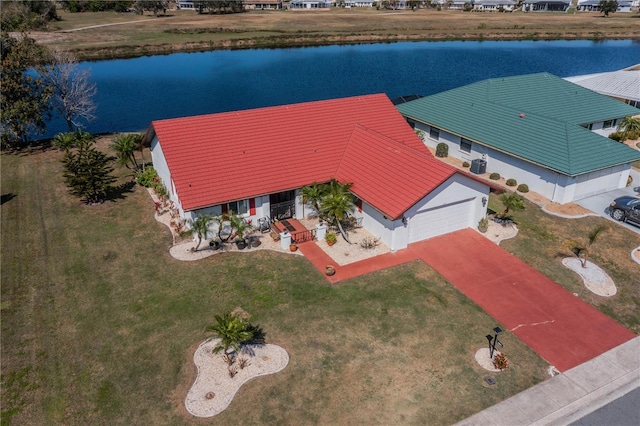 drone / aerial view with a water view