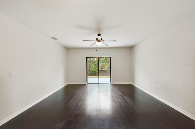 unfurnished room featuring ceiling fan and dark hardwood / wood-style flooring