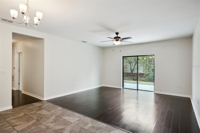 unfurnished room with ceiling fan with notable chandelier and hardwood / wood-style flooring