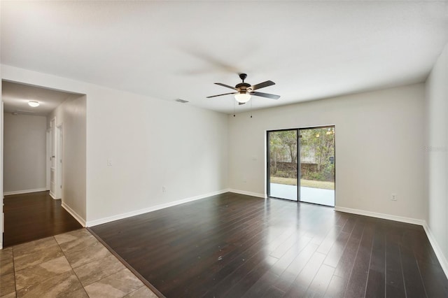 empty room with ceiling fan and hardwood / wood-style floors