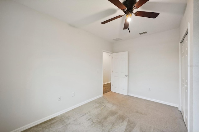 unfurnished bedroom featuring ceiling fan and carpet floors