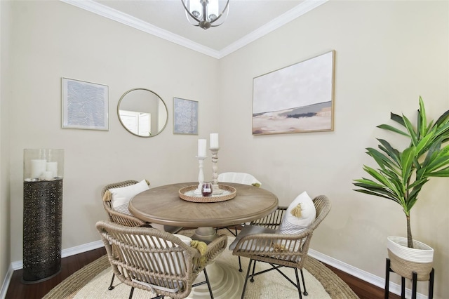 dining area featuring crown molding and dark wood-type flooring