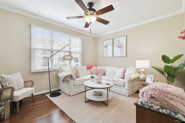 living room featuring crown molding, ceiling fan, and dark hardwood / wood-style flooring