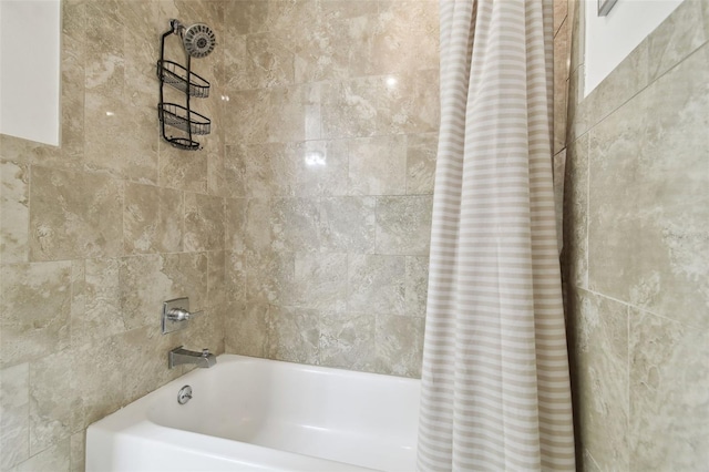 bathroom featuring shower / bath combo with shower curtain