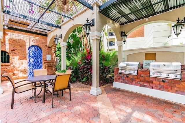 view of patio featuring exterior kitchen and grilling area