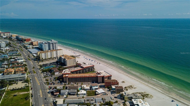 bird's eye view featuring a water view and a view of the beach