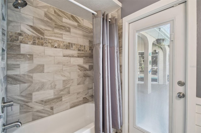 bathroom with shower / tub combo