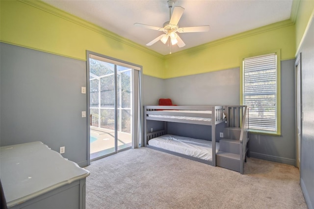 bedroom featuring ceiling fan, light colored carpet, crown molding, and access to outside