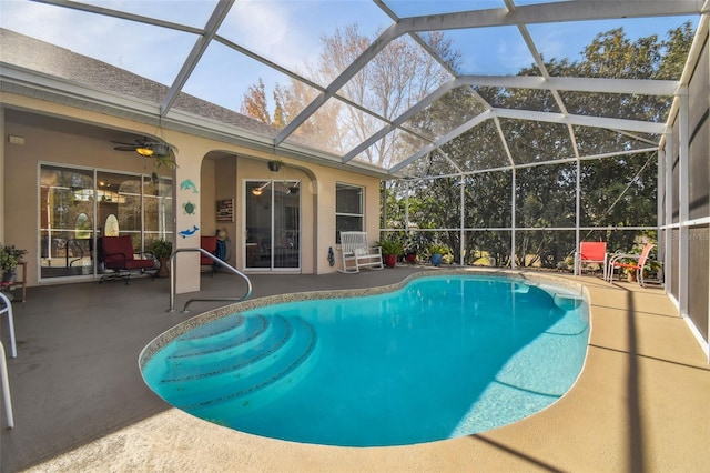 view of pool featuring a lanai, ceiling fan, and a patio area