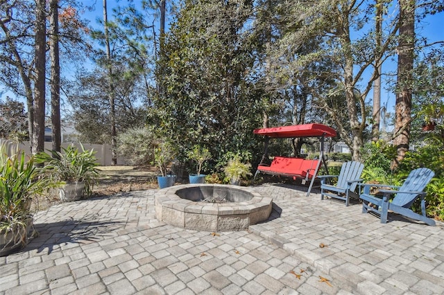 view of patio with a fire pit