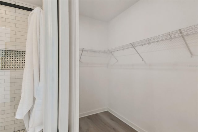 walk in closet featuring hardwood / wood-style floors