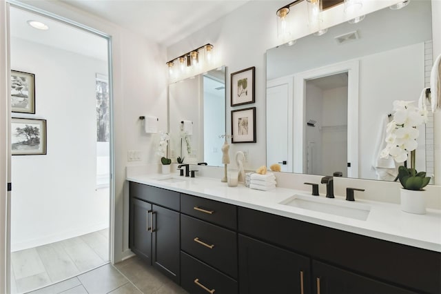 bathroom with vanity and tile patterned flooring