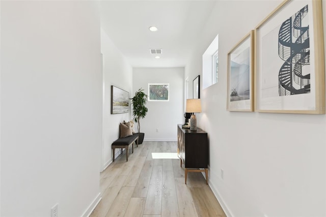 hall with light wood-type flooring