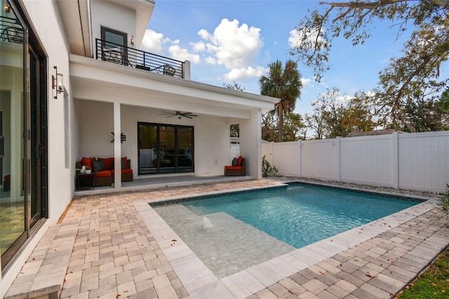 view of pool featuring ceiling fan and a patio