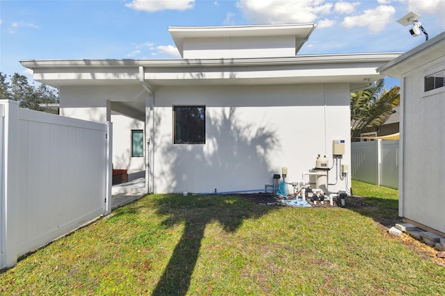 rear view of house with a yard