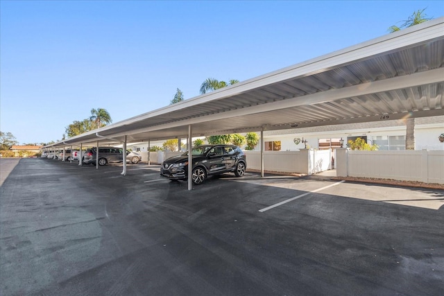 view of vehicle parking featuring a carport